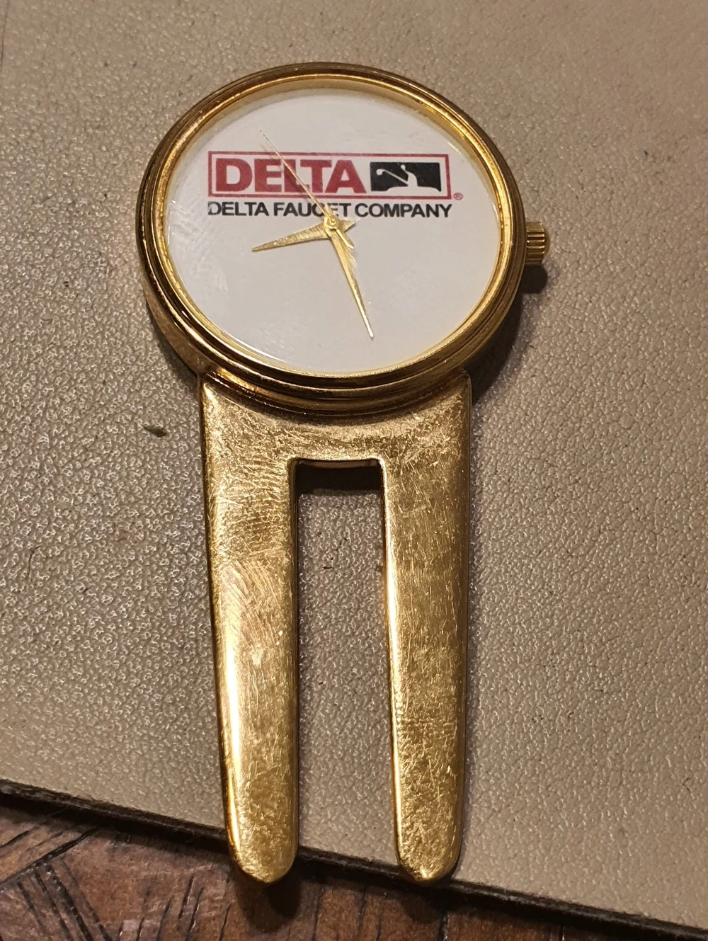 10/$20 Delta Faucet Company Goldtone/White Divot Repair Tool Watch